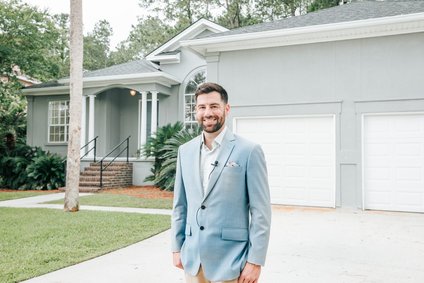 Chris Lawlor standing outside a coastal Savannah listing